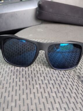Oakley Black Frame Sunglasses with Blue Mirrored Lenses